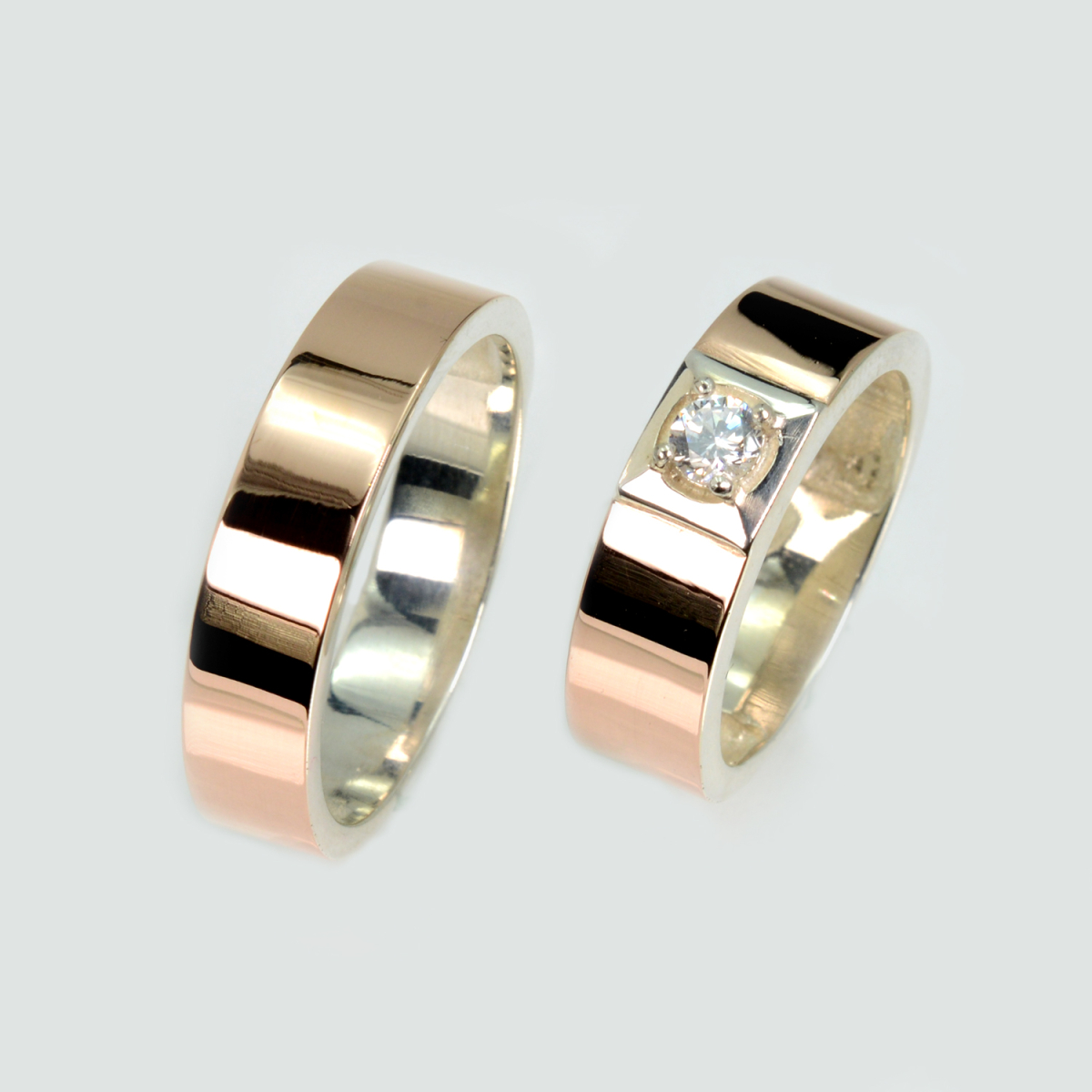 Пара срібних обручок з золотом