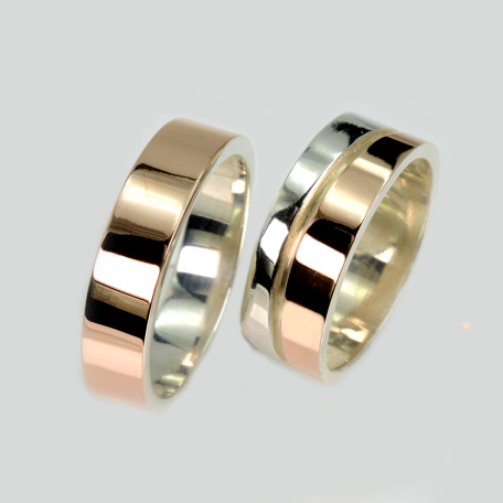 Пара обручальных колец из серебра с золотом