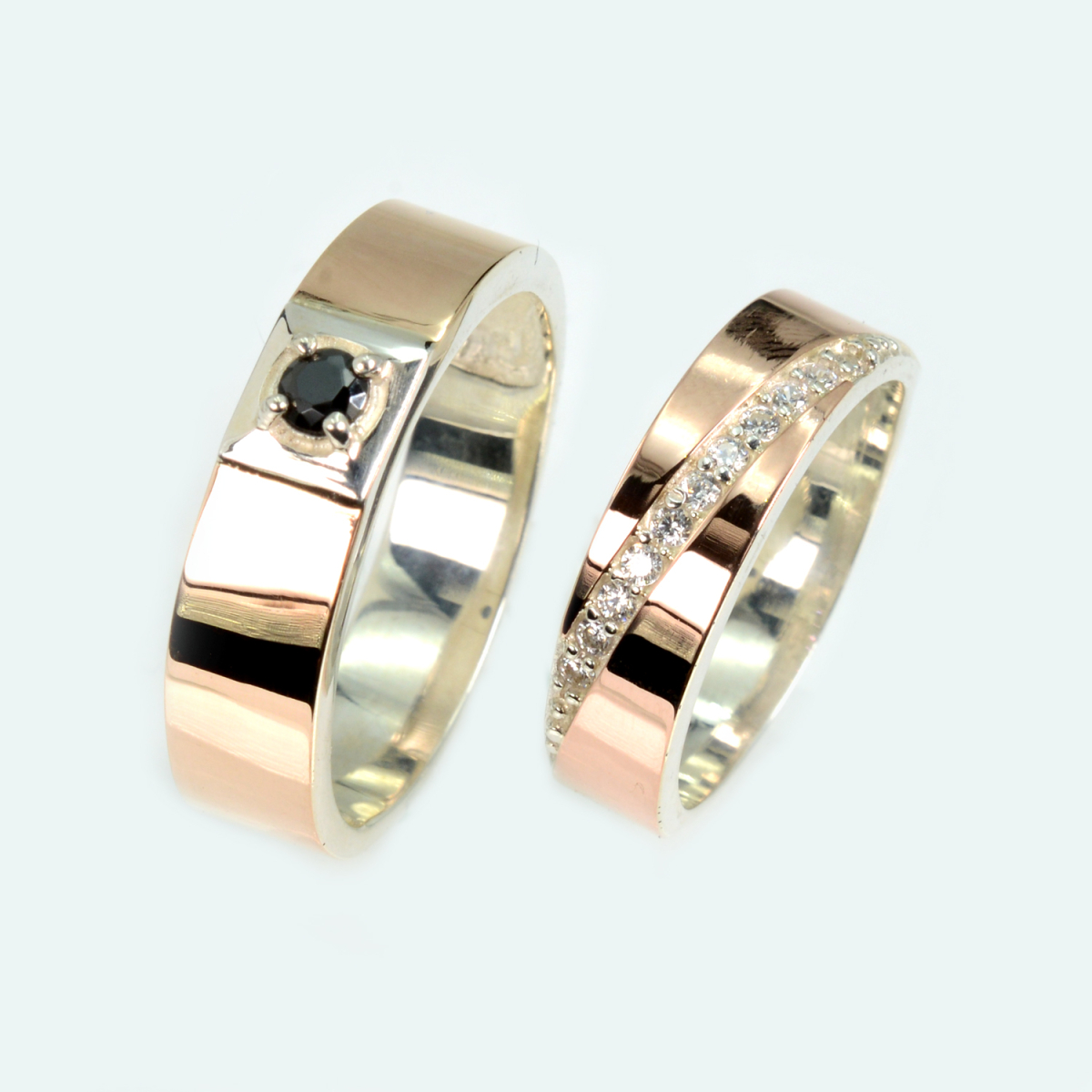 Пара срібних обручок з золотом