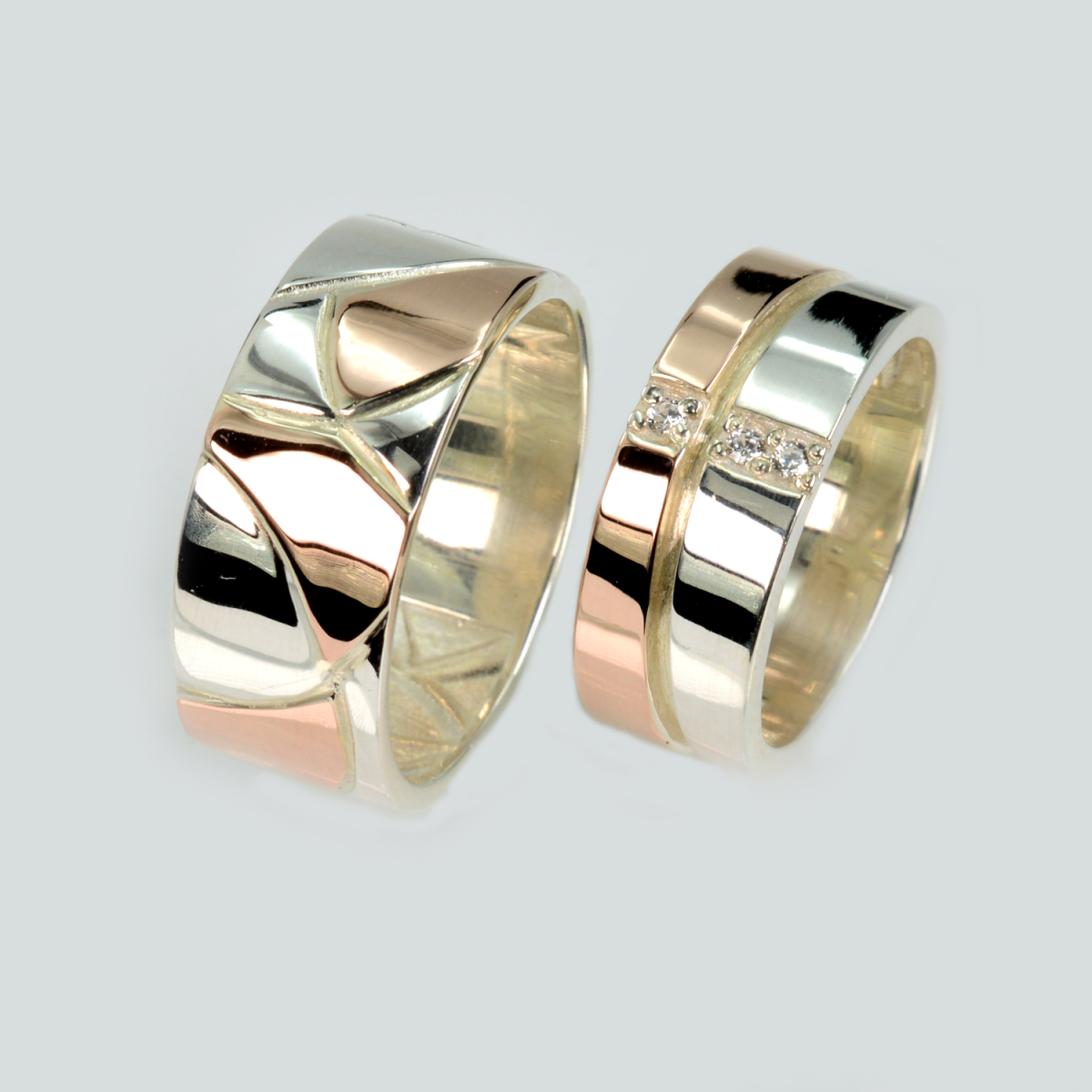 Пара срібних обручок з золотом