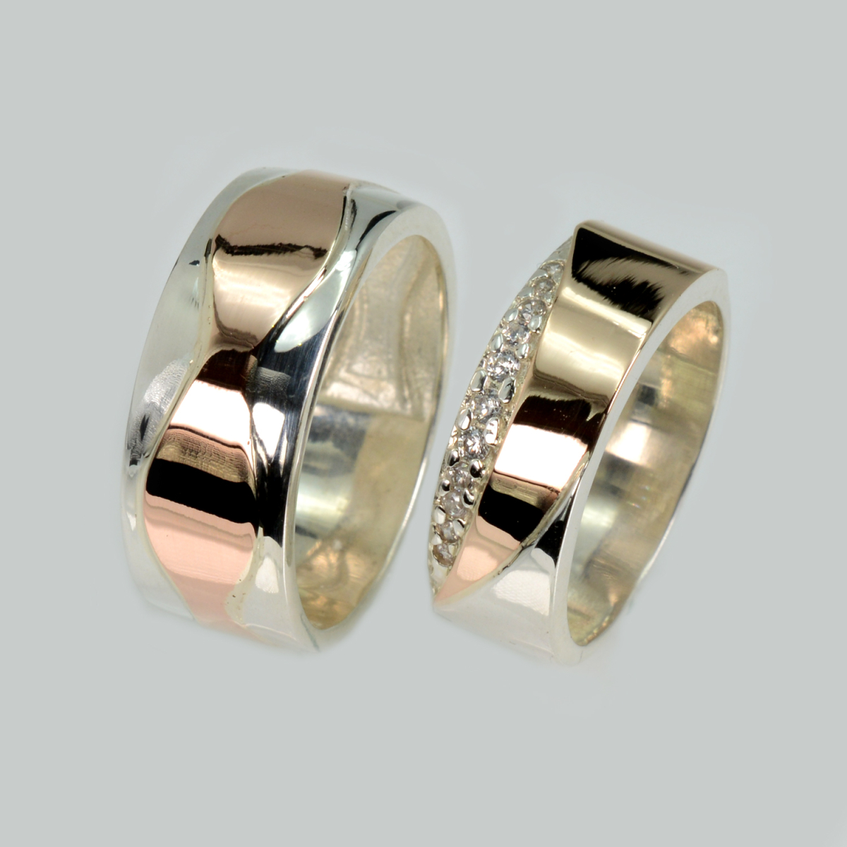 Пара срібних обручок з золотом