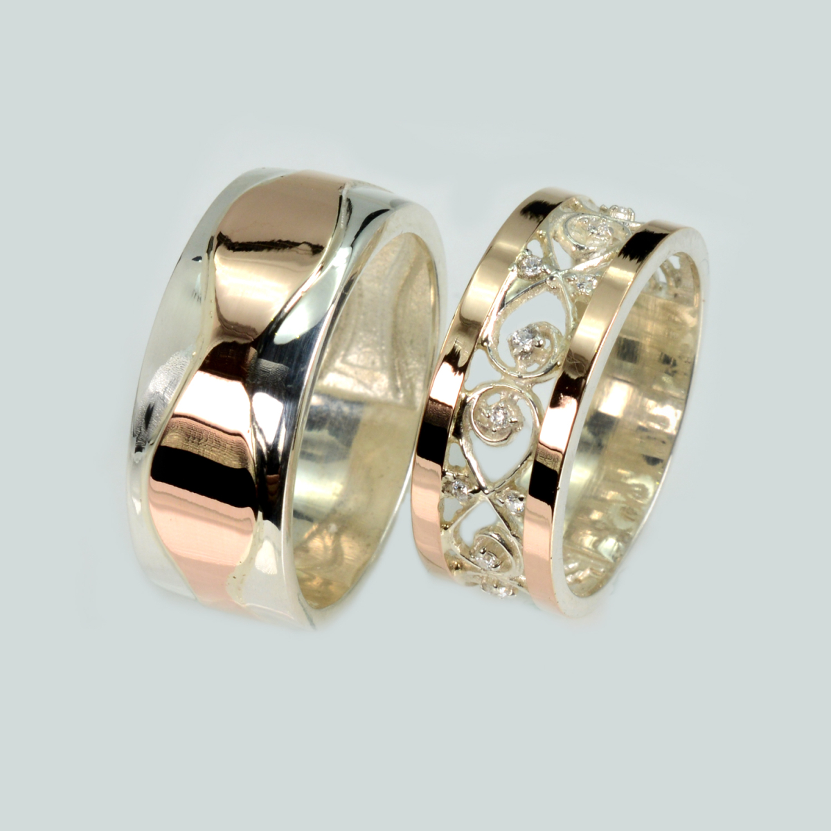 Пара срібних обручок з золотом