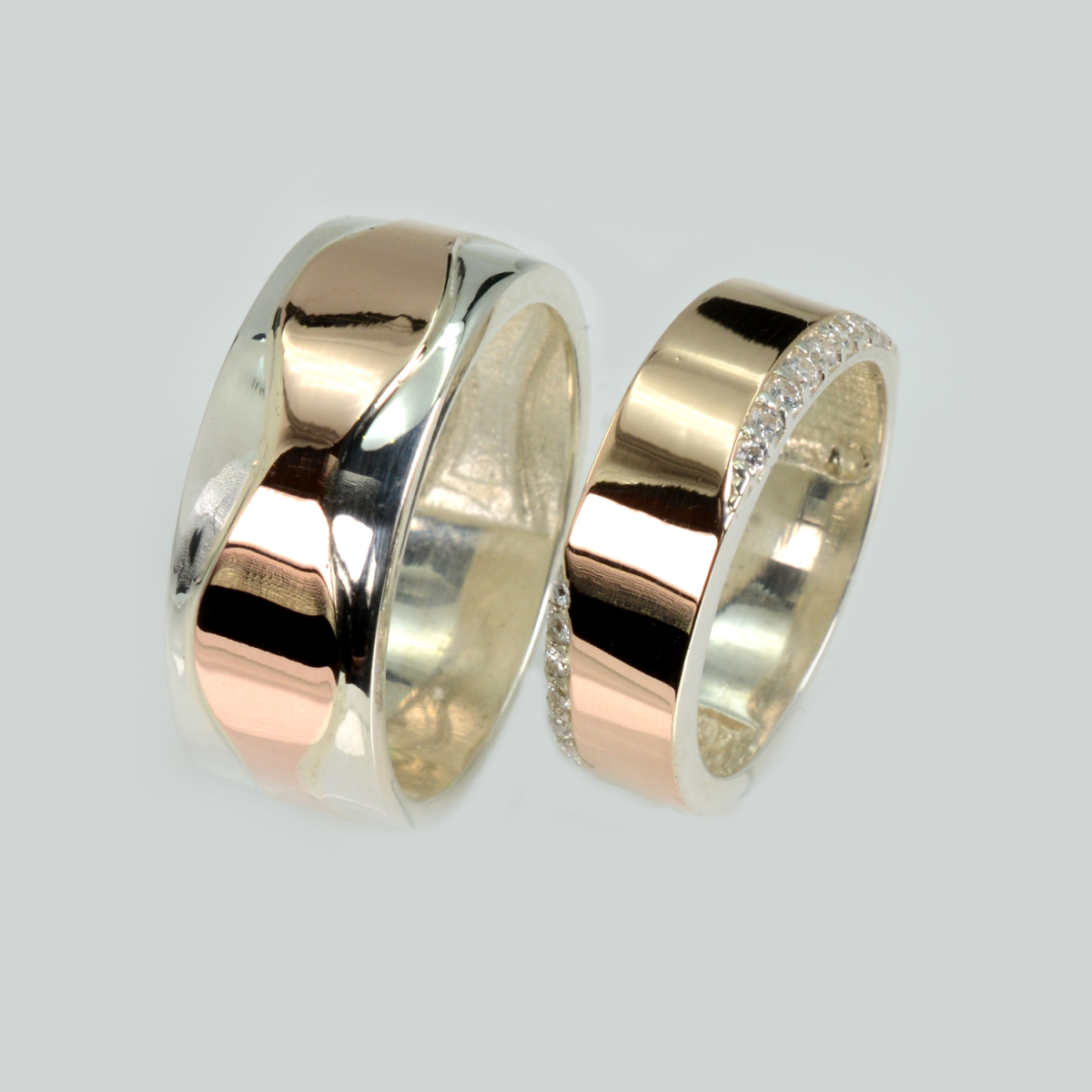 Пара срібних обручок з золотом