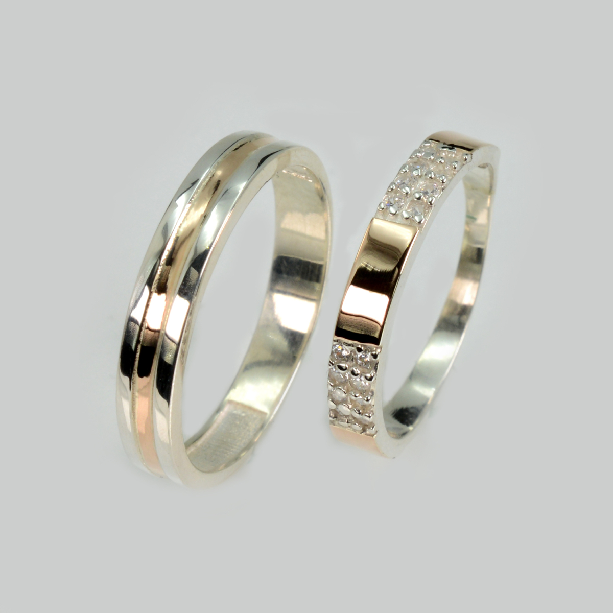 Пара срібних обручок з золотом