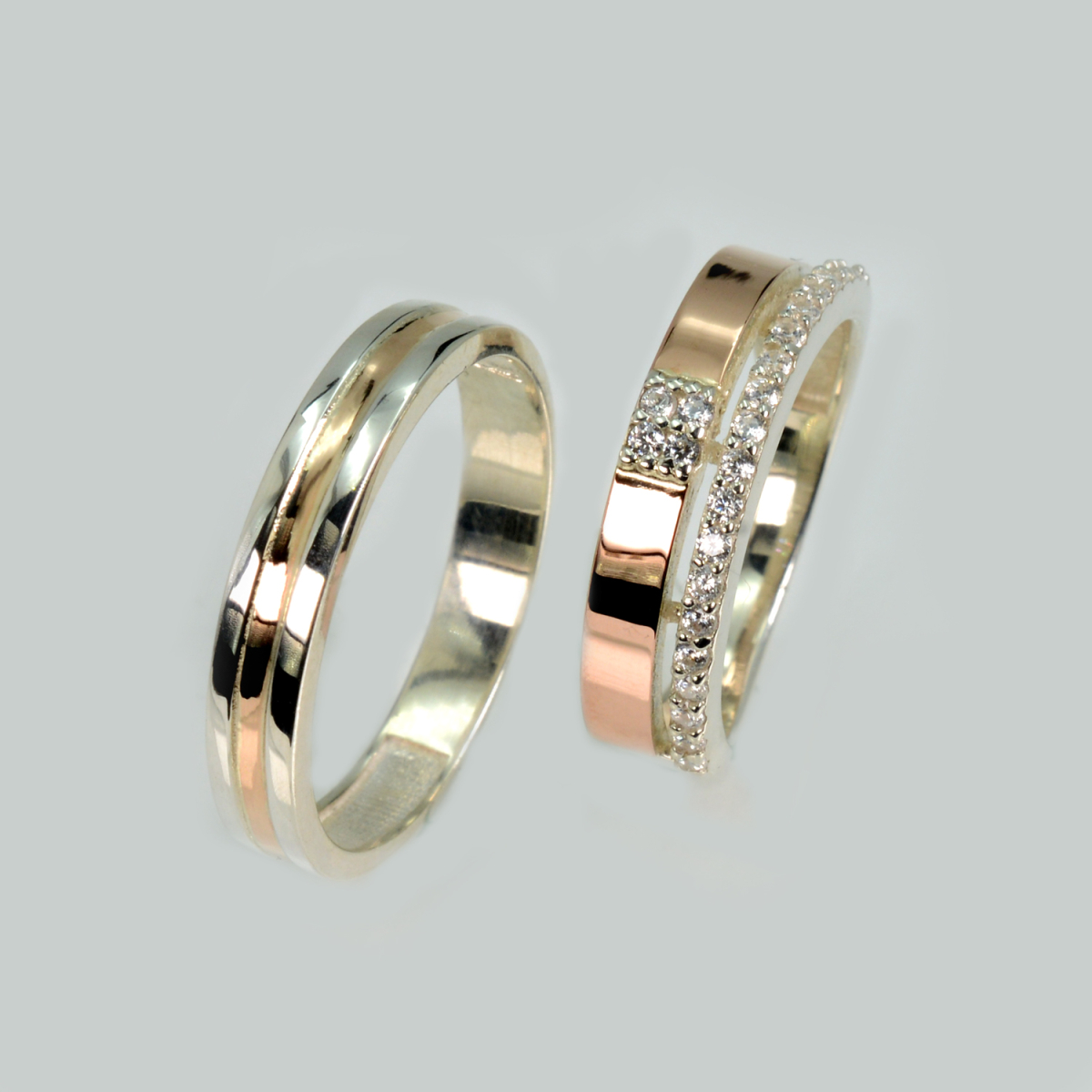 Пара срібних обручок з золотом