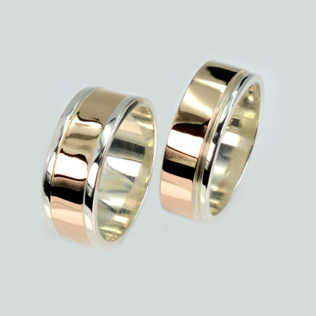 Пара срібних обручок з золотом