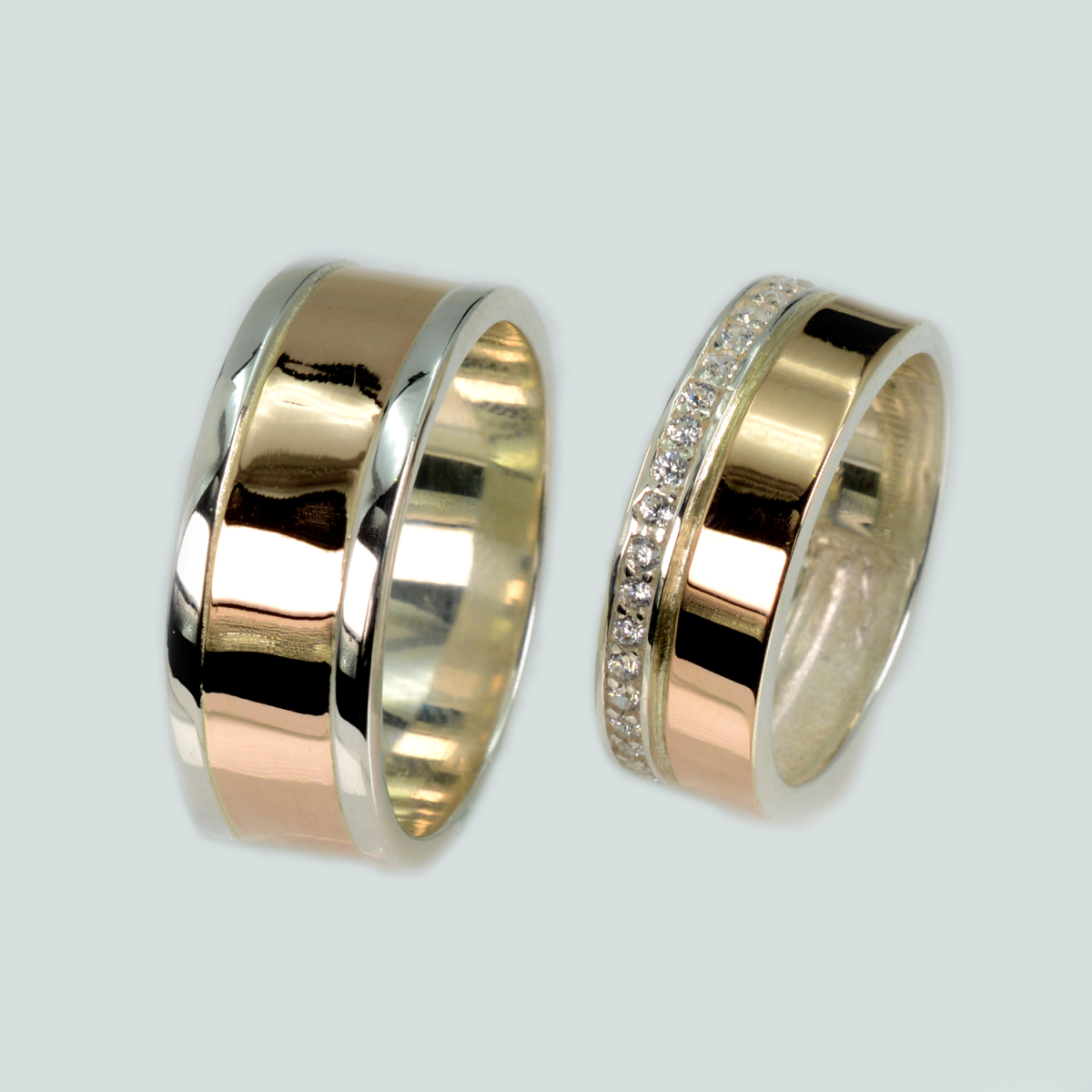 Пара срібних обручок з золотом