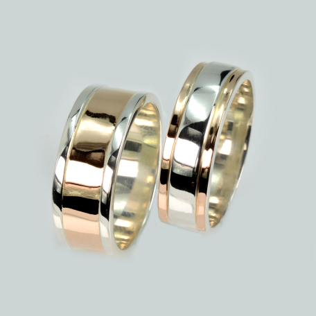 Пара срібних обручок з золотом