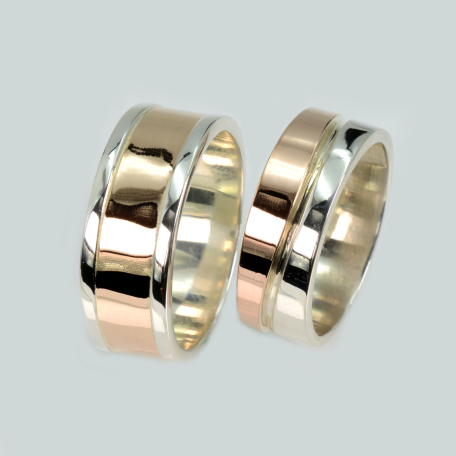 Пара обручальных колец из серебра с золотом