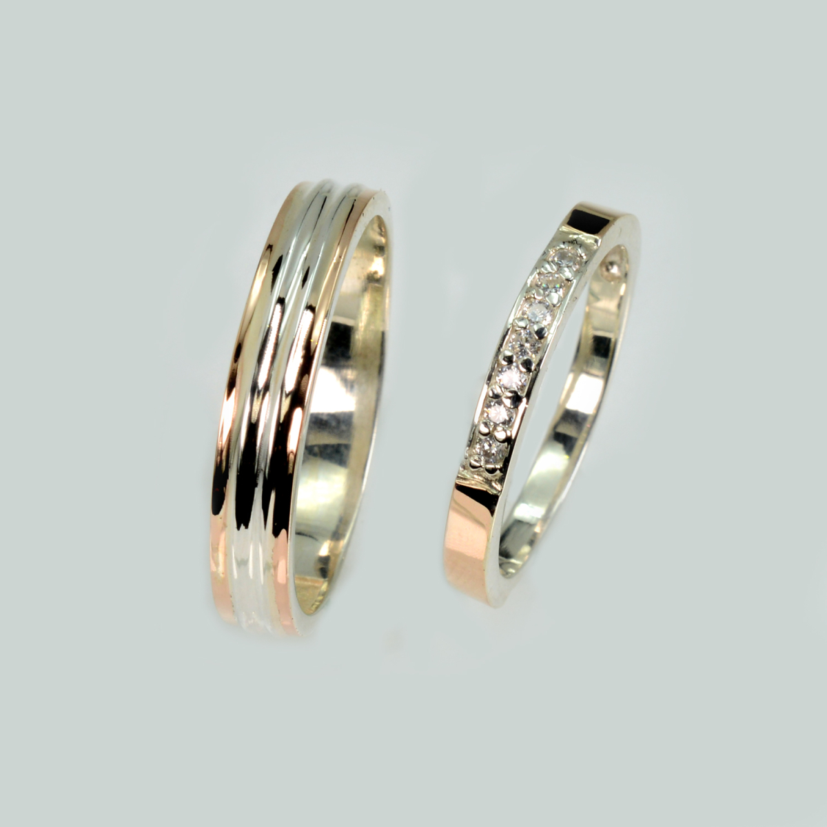 Пара срібних обручок з золотом