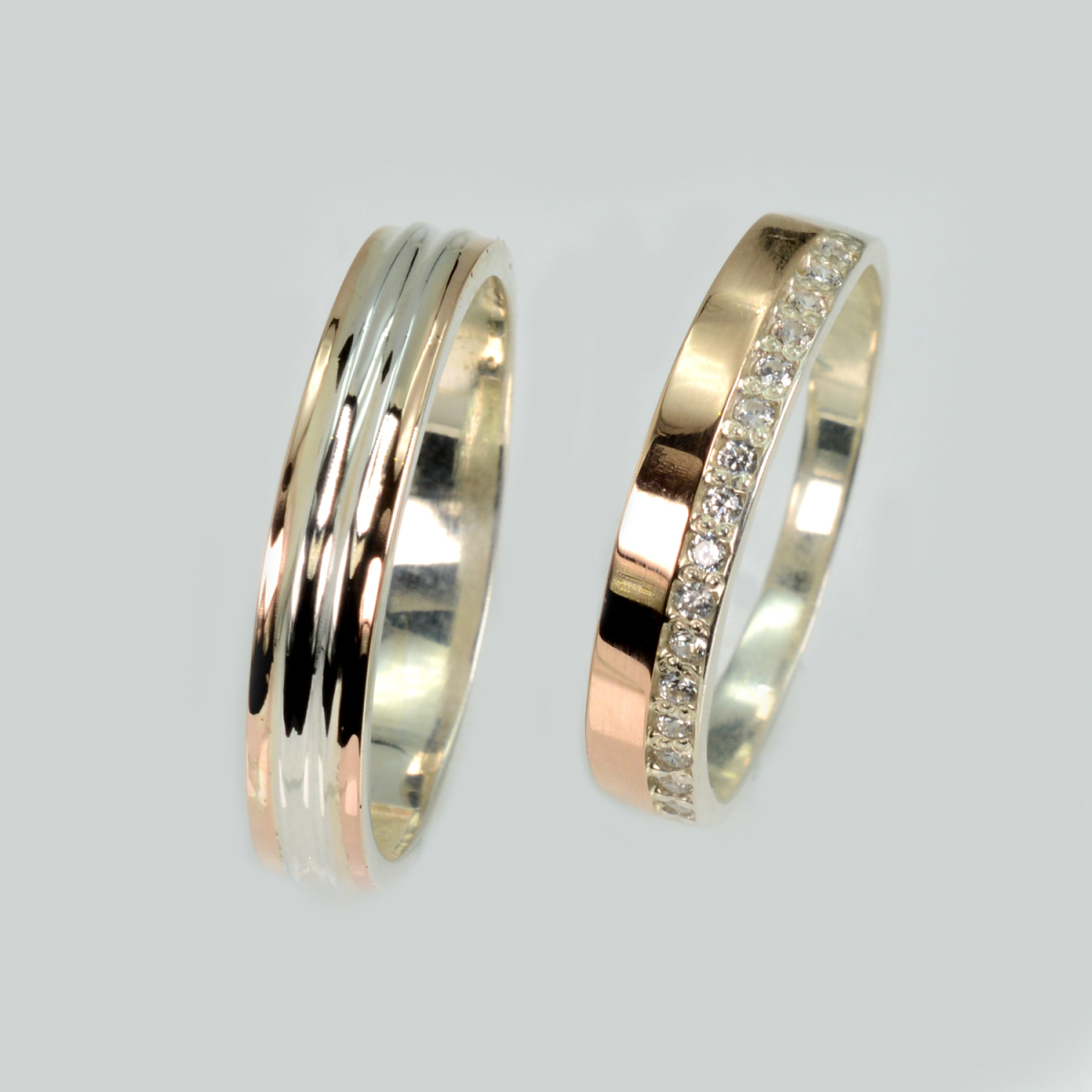 Пара срібних обручок з золотом