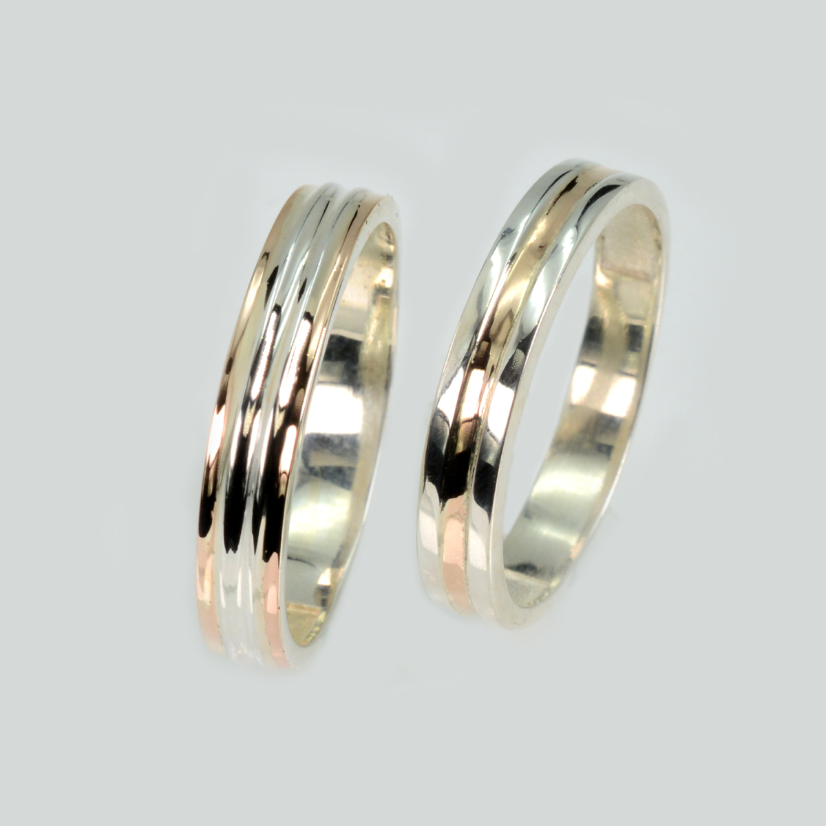 Пара срібних обручок з золотом