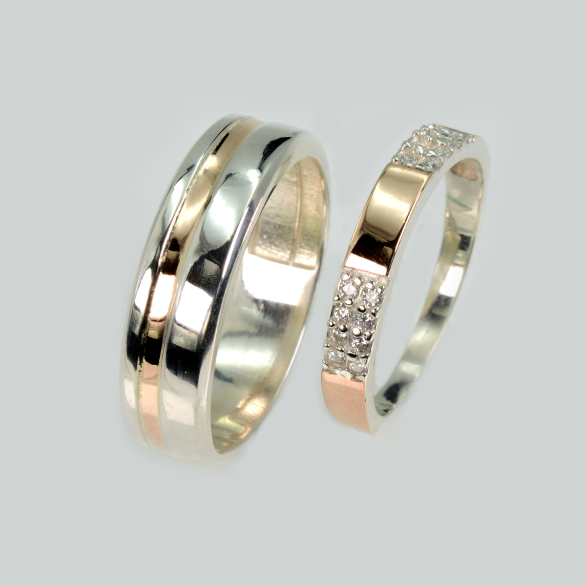 Пара срібних обручок з золотом