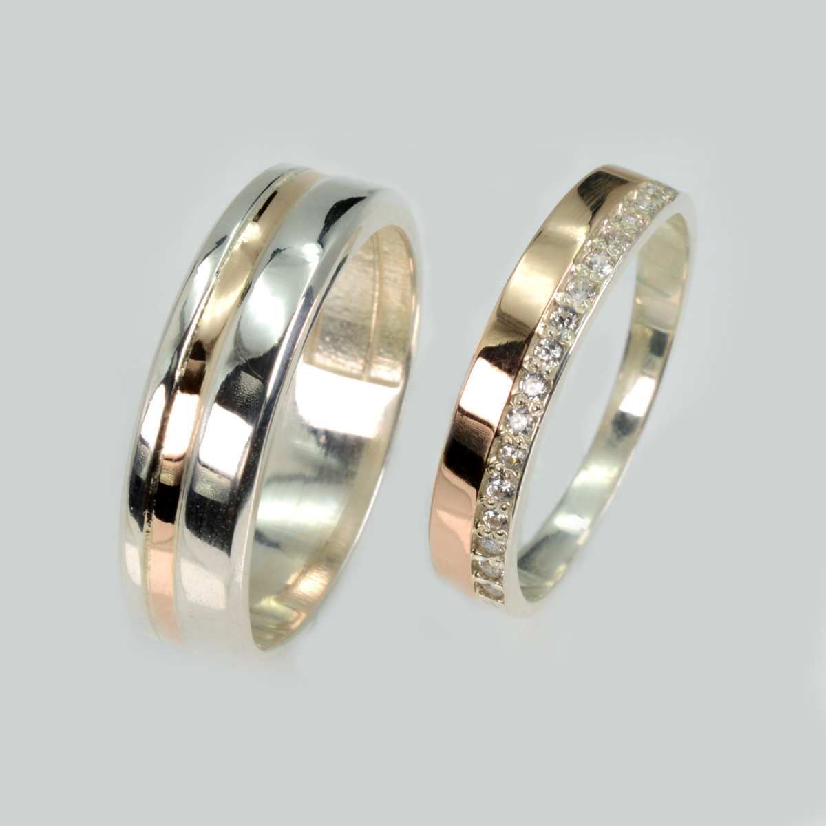 Пара срібних обручок з золотом