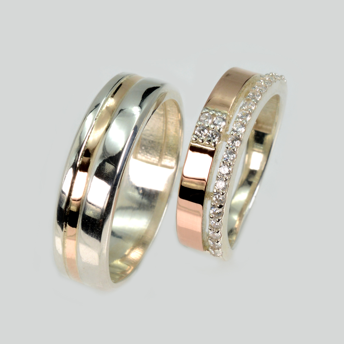 Пара срібних обручок з золотом