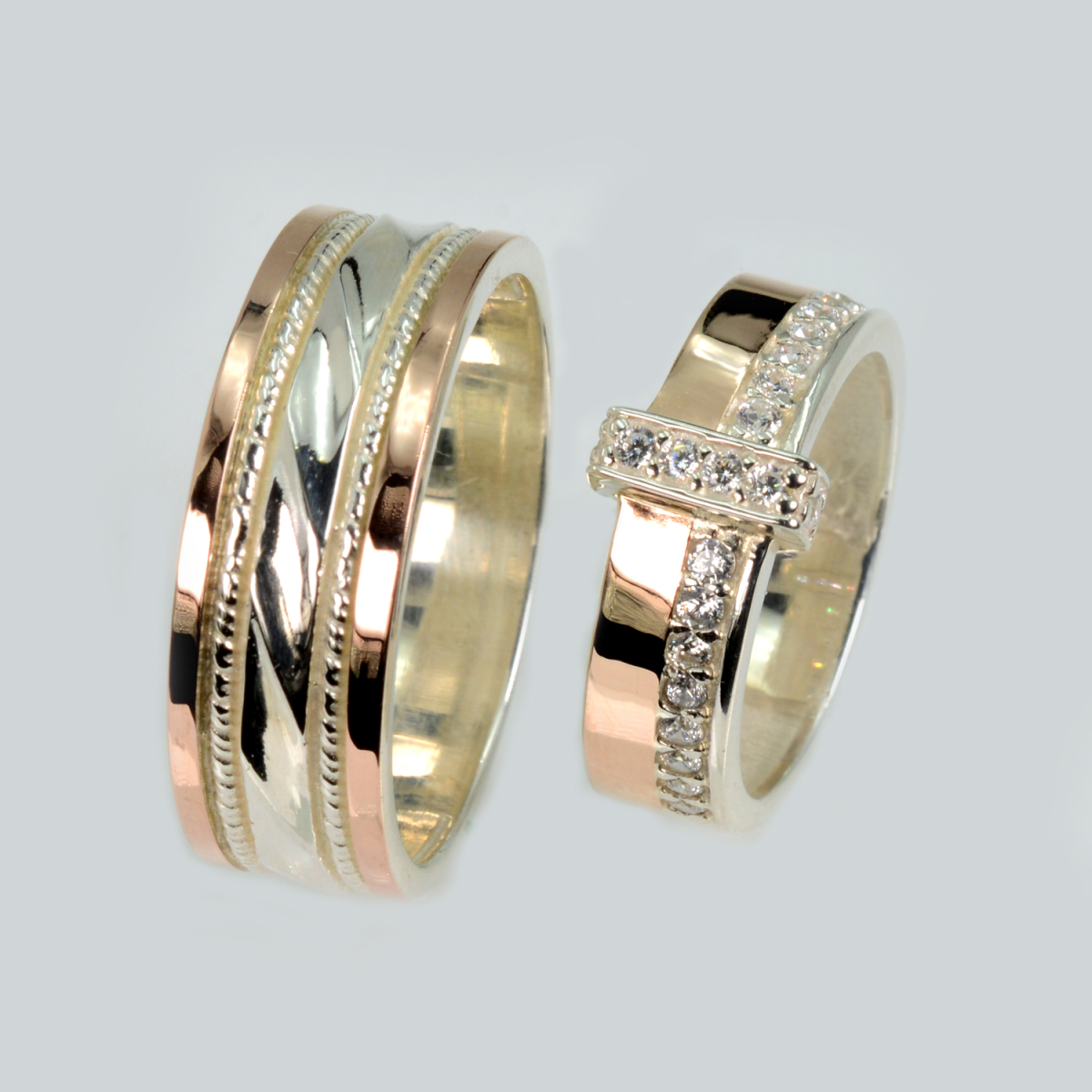 Пара срібних обручок з золотом