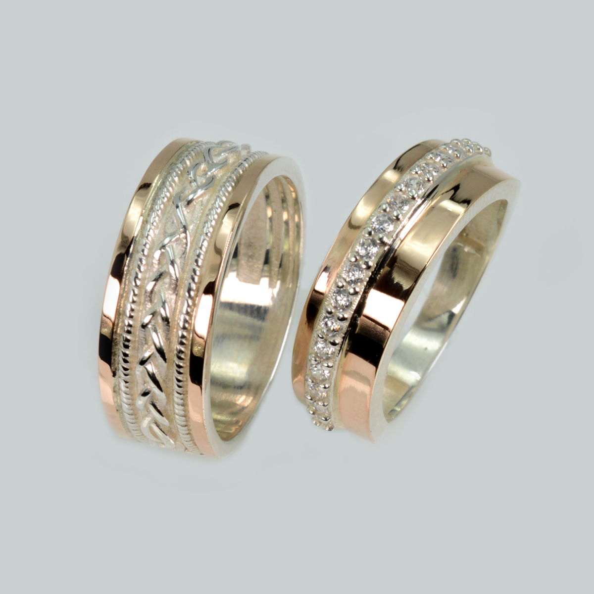 Пара срібних обручок з золотом