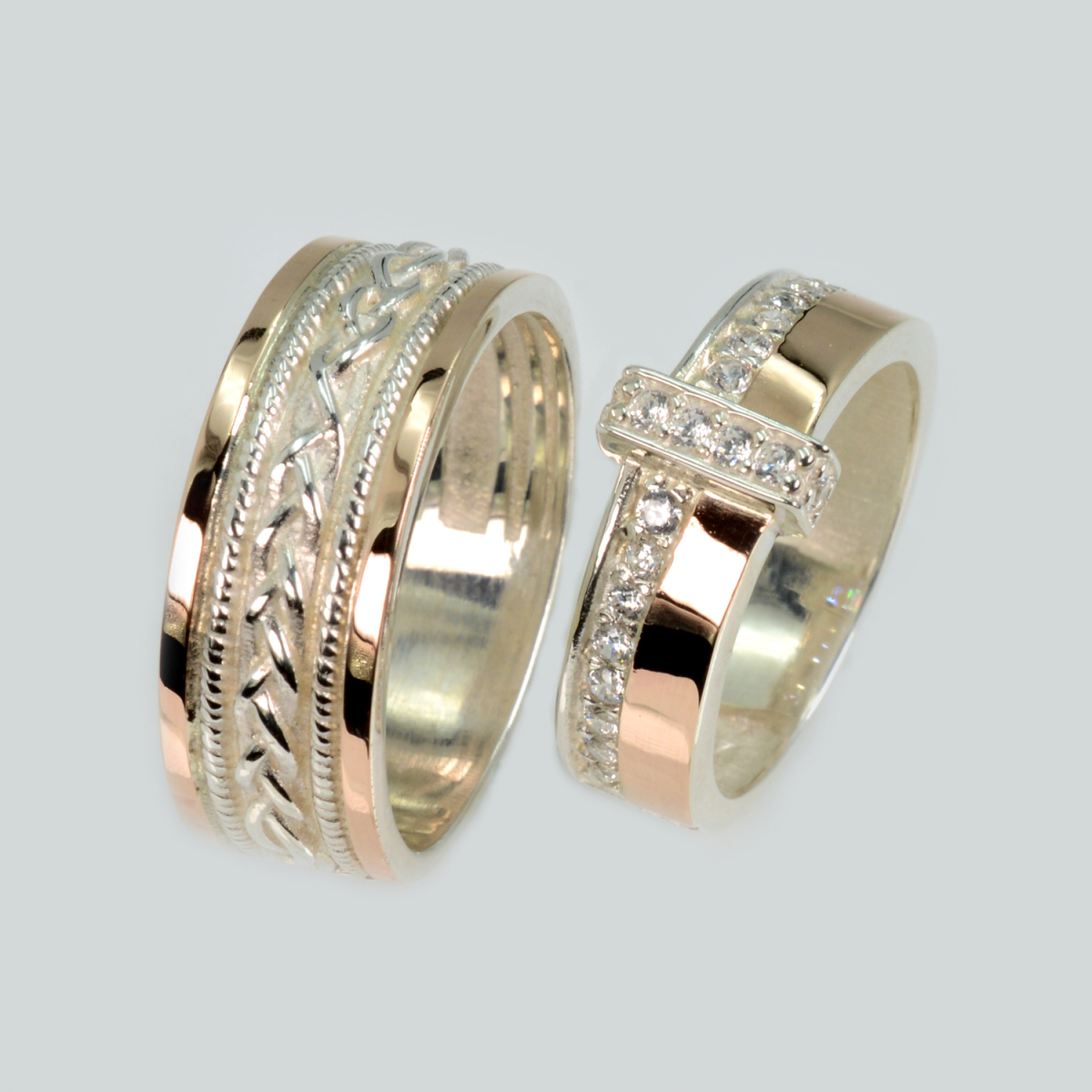 Пара срібних обручок з золотом