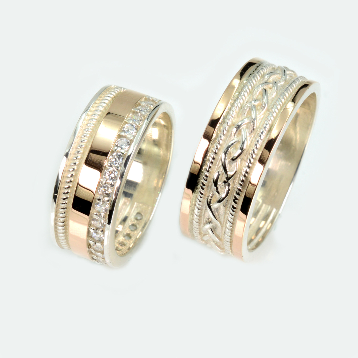 Пара срібних обручок з золотом