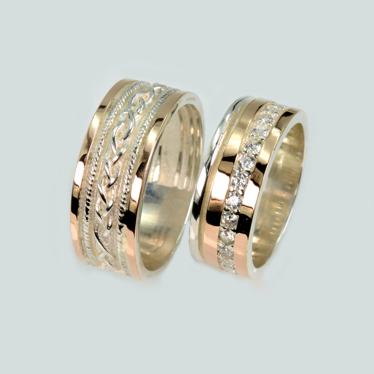 Пара срібних обручок з золотом