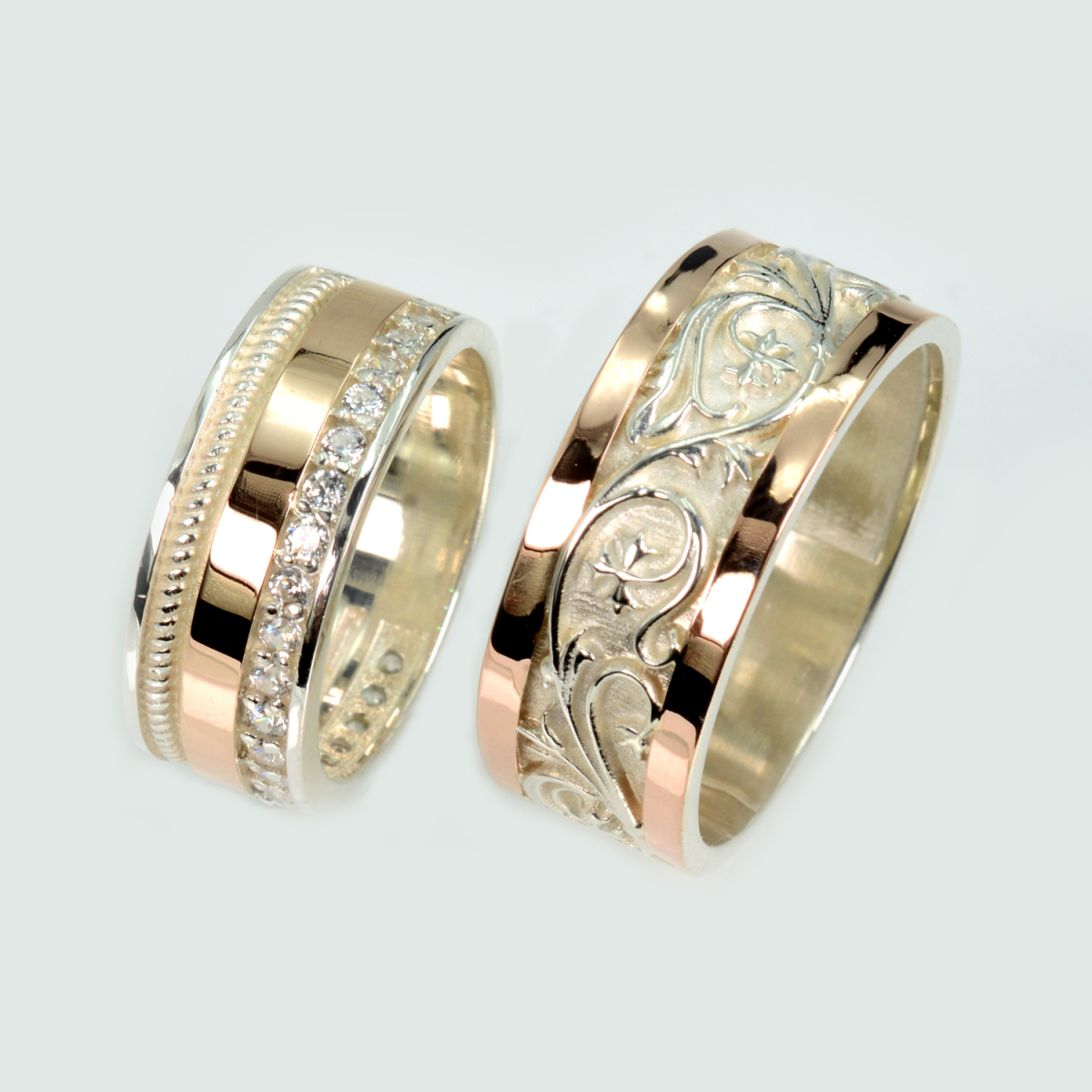 Пара срібних обручок з золотом