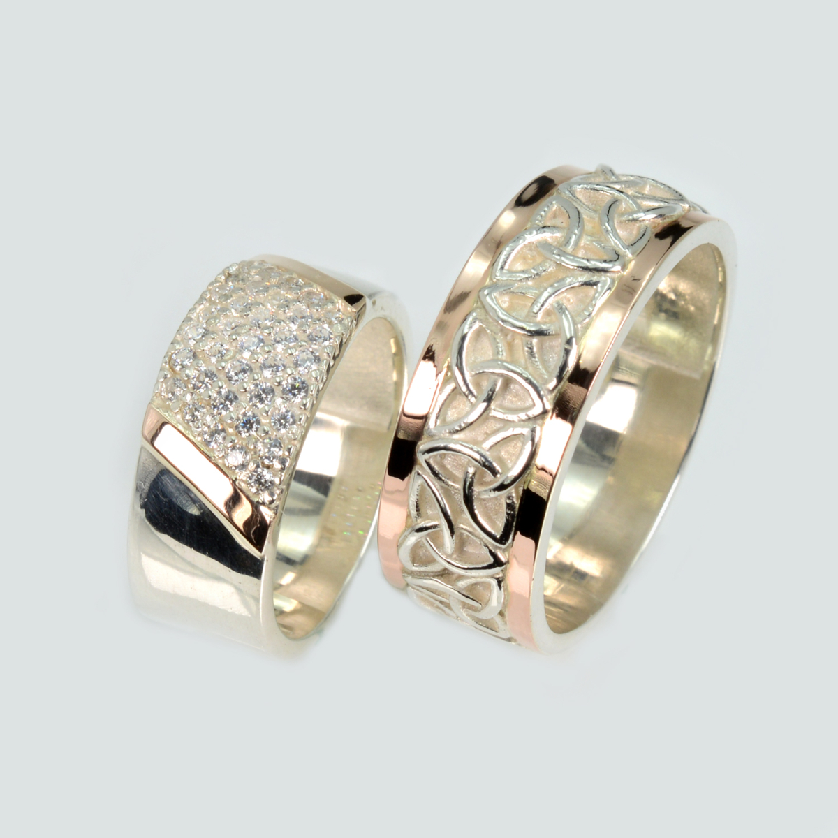 Пара срібних обручок з золотом