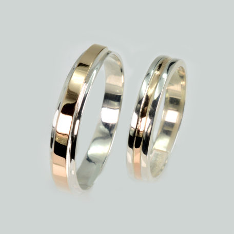 Пара обручальных колец из серебра и золота