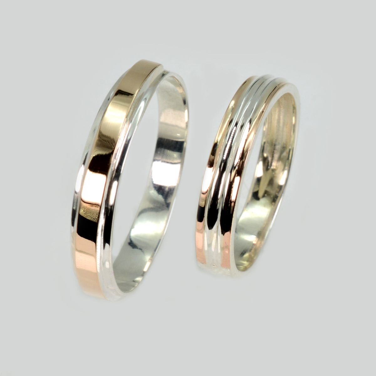 Пара срібних обручок з золотом