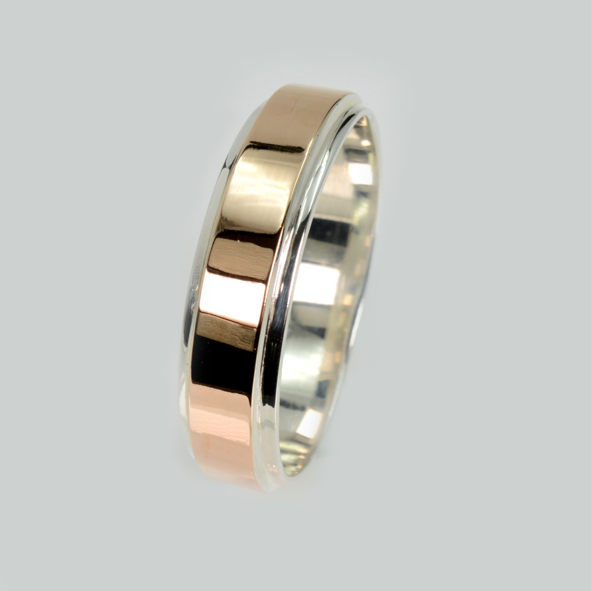 Срібна обручка з золотими пластинами