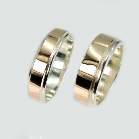 Пара срібних обручок з золотом