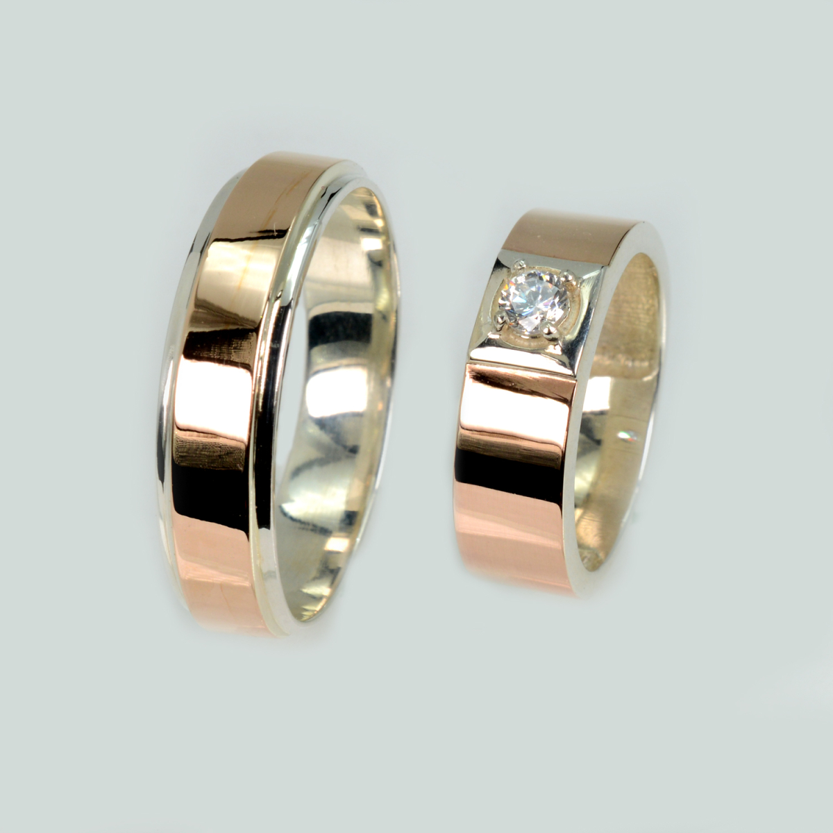 Пара срібних обручок з золотом