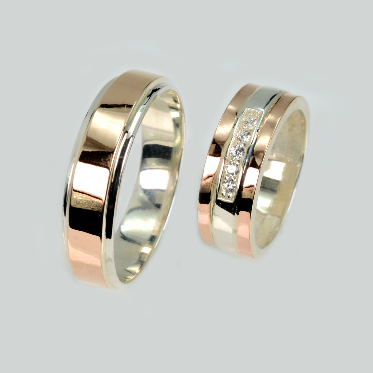 Пара срібних обручок з золотом