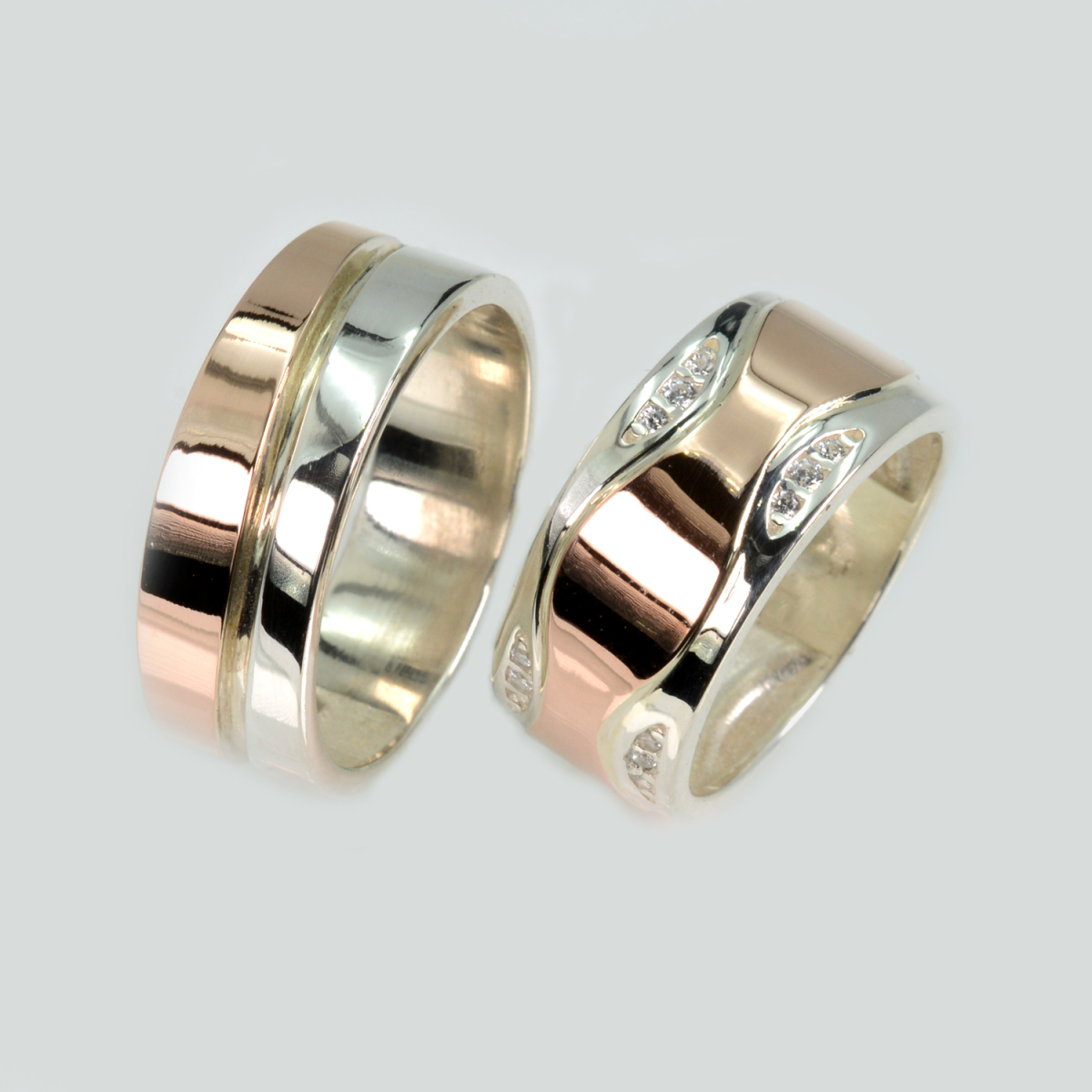 Пара срібних обручок з золотом